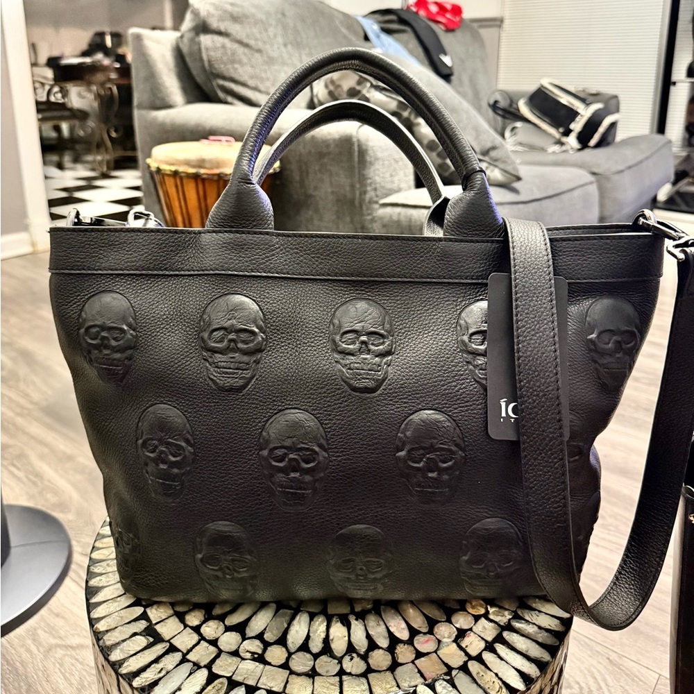 Edgy Black Skull Embossed Tote Bag with large skull key charm by betsey Johnson.